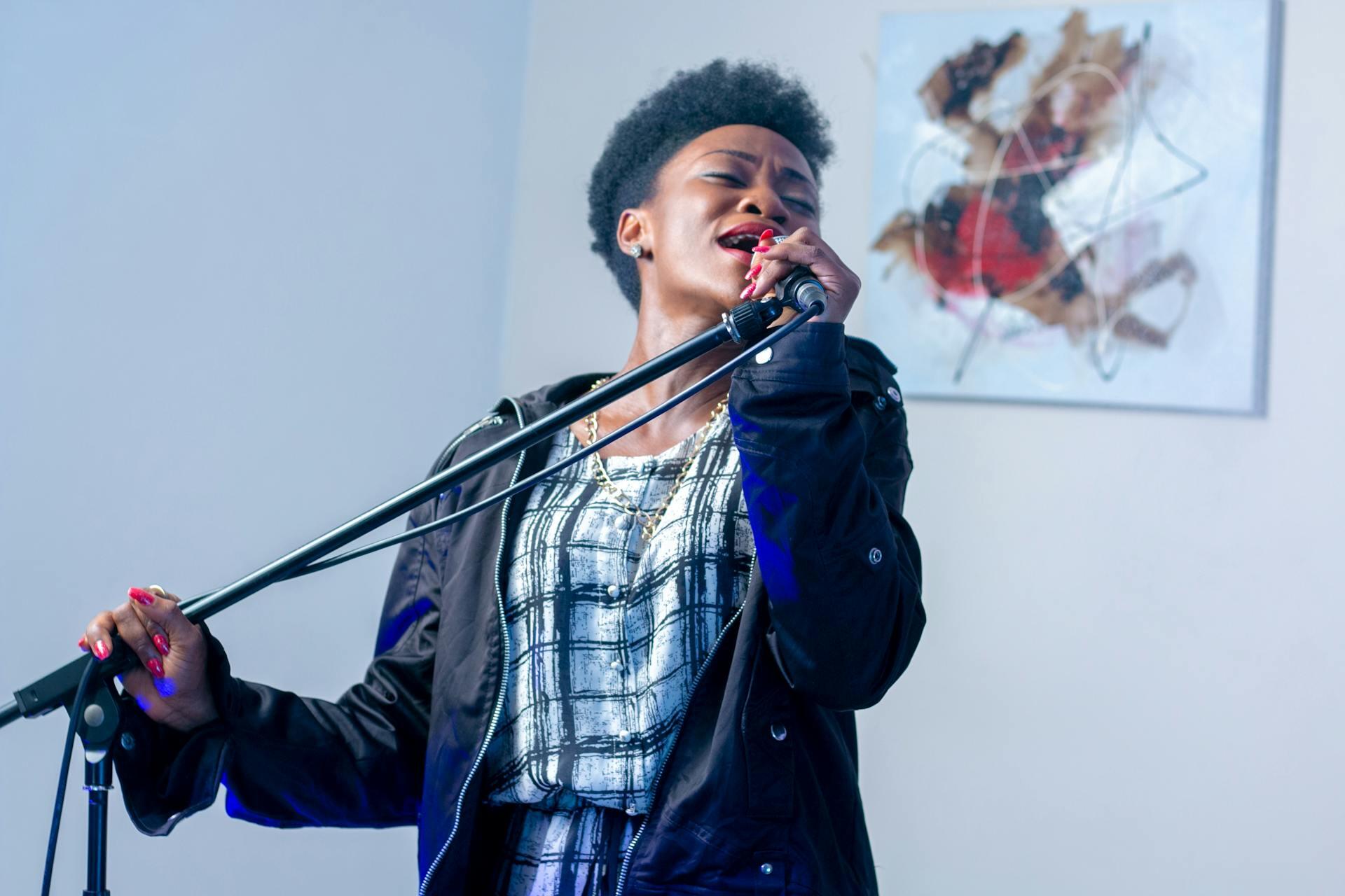 Lady singing into microphone